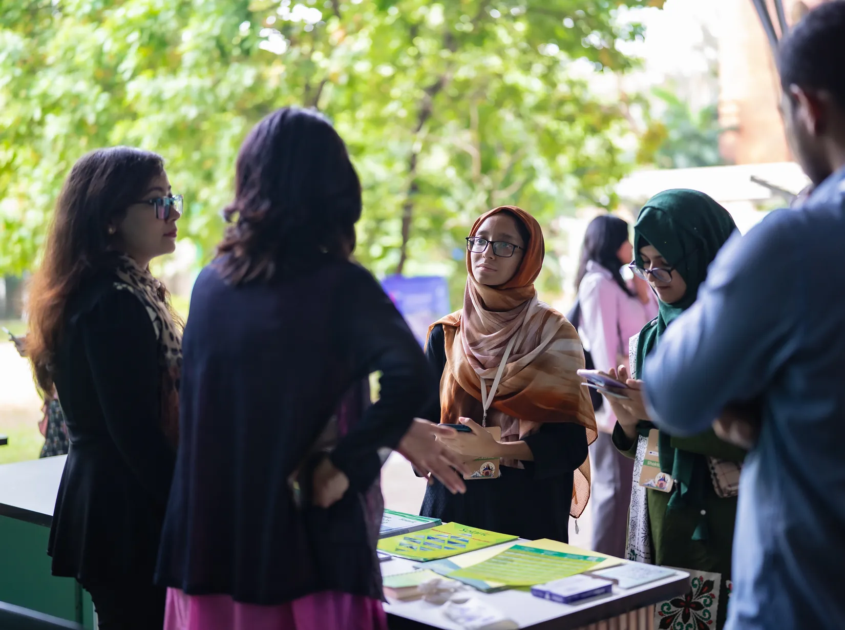 Participants speaking with a solar company at the Green Skills Summit