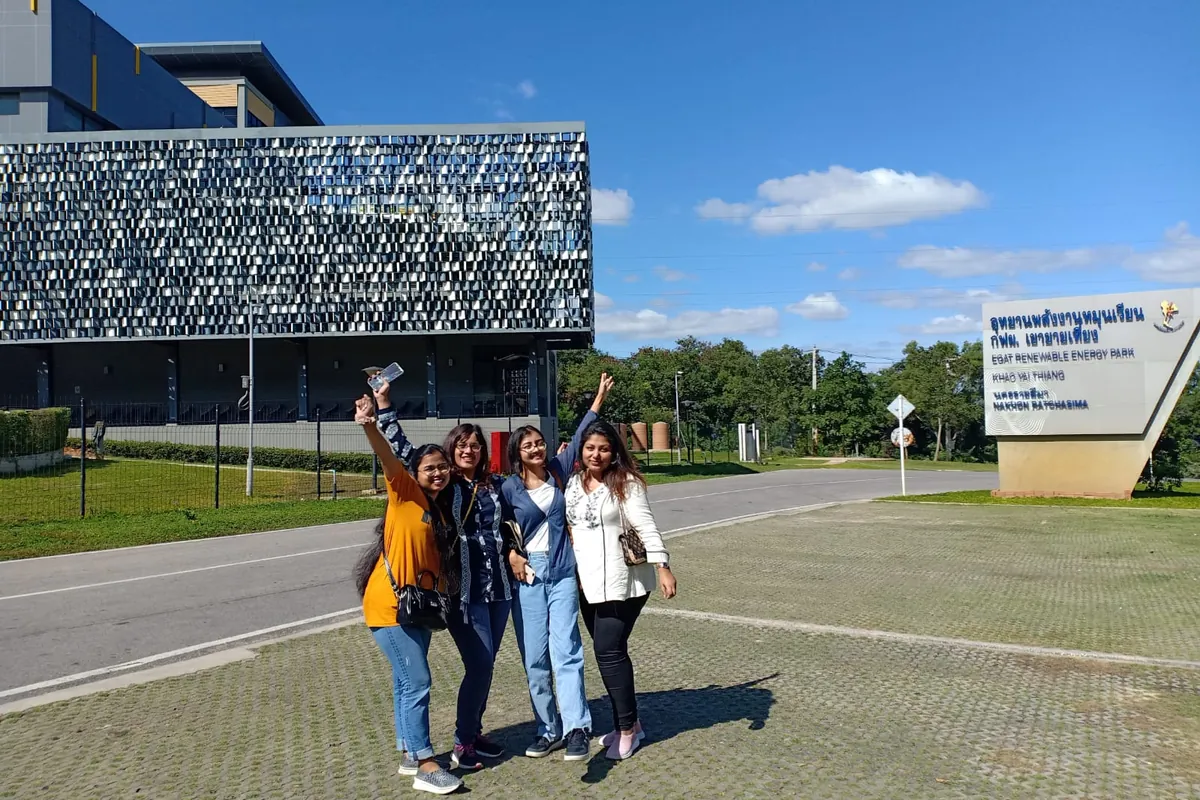 Four Shoktikonnas celebrating outside the EGAT Renewable Energy Park in Thailand